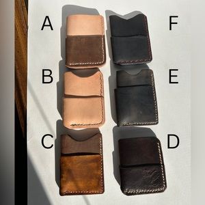 Handmade leather card/cash holders! All shades of brown and black.